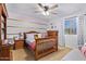 Charming bedroom with wooden furniture and decor at 30276 W Crittenden Ln, Buckeye, AZ 85396
