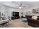 Relaxing living room with comfortable seating and large TV at 30276 W Crittenden Ln, Buckeye, AZ 85396