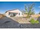 Landscaped backyard with a patio and desert landscaping at 32330 N Hermon Rd, San Tan Valley, AZ 85143