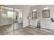 Bathroom with double vanities, marble shower, and mirrored closet at 340 W Locust Dr, Chandler, AZ 85248