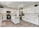 Modern kitchen with white cabinets and center island at 340 W Locust Dr, Chandler, AZ 85248