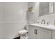 Modern powder room with white vanity and wainscoting at 340 W Locust Dr, Chandler, AZ 85248