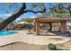 Community pool with covered seating, BBQ area, and lounge chairs at 34746 N 30Th Dr, Phoenix, AZ 85086