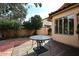 Backyard patio with table and gravel landscaping at 3502 E Tonto Ln, Phoenix, AZ 85050