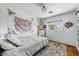 Bedroom with a bed, tapestry, and window at 4047 E Highland Ave, Phoenix, AZ 85018