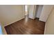 Bright bedroom with wood-look floors and mirrored closet doors at 6410 S Kimberlee Way, Chandler, AZ 85249