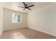 Spacious bedroom with hardwood floors and window at 813 E Garnet Ave, Mesa, AZ 85204