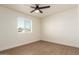 Spacious bedroom with wood-look floors and window with blinds at 813 E Garnet Ave, Mesa, AZ 85204