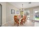 Bright dining room with wooden table and chairs, near kitchen at 846 S Stilton Cir, Mesa, AZ 85208