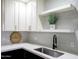 Stylish kitchen sink with quartz countertop and floating shelves at 101 N 7Th St # 159, Phoenix, AZ 85034