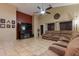 Living room featuring a sectional sofa and TV at 10776 W Encanto Blvd, Avondale, AZ 85392