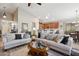 Spacious living room with light beige couches, wood coffee table, and high ceilings at 1134 E Jahns Dr, Casa Grande, AZ 85122