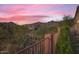 Stunning sunset view over desert landscape and mountain range in the background at 13037 E Jenan Dr, Scottsdale, AZ 85259