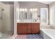 Double vanity bathroom with soaking tub and walk-in shower at 1321 W Clear Spring Dr, Gilbert, AZ 85233