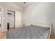 Bedroom with sliding door to closet and wood flooring at 1321 W Clear Spring Dr, Gilbert, AZ 85233