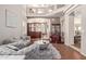Open living room with hardwood floors, high ceilings, and built-in shelving at 1321 W Clear Spring Dr, Gilbert, AZ 85233