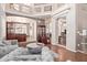 Open living room with hardwood floors, high ceilings, and built-in shelving at 1321 W Clear Spring Dr, Gilbert, AZ 85233