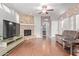 Spacious living room featuring a stone fireplace and hardwood floors at 1321 W Clear Spring Dr, Gilbert, AZ 85233