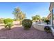 Landscaped backyard with desert landscaping, and golf course view at 13414 W Micheltorena Dr, Sun City West, AZ 85375