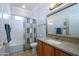 Clean bathroom with shower/tub, vanity, and mirror at 13414 W Micheltorena Dr, Sun City West, AZ 85375