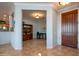 Bright entryway with built-in shelving and wood door at 13414 W Micheltorena Dr, Sun City West, AZ 85375