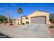 Single-story home with a two-car garage and desert landscaping at 13414 W Micheltorena Dr, Sun City West, AZ 85375