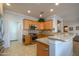Kitchen with stainless steel appliances and light wood cabinets at 13414 W Micheltorena Dr, Sun City West, AZ 85375