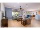 Spacious living room with tile floors and view of backyard at 13414 W Micheltorena Dr, Sun City West, AZ 85375
