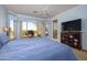 Main bedroom with large window and direct access to patio at 13414 W Micheltorena Dr, Sun City West, AZ 85375
