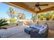 Covered patio with seating area and built-in grill at 13414 W Micheltorena Dr, Sun City West, AZ 85375