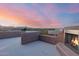 Private rooftop patio with mountain views and a fireplace at 13829 N Sunflower Dr, Fountain Hills, AZ 85268