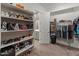 Large walk-in closet with ample shelving and hanging space at 14196 W Gray Fox Trl, Surprise, AZ 85387