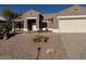 Single-story home with a two-car garage and desert landscaping at 14426 W Gunsight Dr, Sun City West, AZ 85375