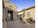 Outdoor seating area with umbrella and bistro table at 17164 W Calistoga Dr, Surprise, AZ 85387