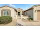 Front exterior view of a single-story home with landscaped yard at 17164 W Calistoga Dr, Surprise, AZ 85387