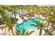 Large community pool with palm trees at 17329 W Gretna St, Surprise, AZ 85388