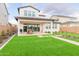 Artificial turf backyard with putting green and patio at 17329 W Gretna St, Surprise, AZ 85388