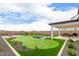 Artificial turf backyard with putting green at 17329 W Gretna St, Surprise, AZ 85388