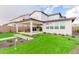 Landscaped backyard with putting green and patio at 17329 W Gretna St, Surprise, AZ 85388
