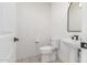 Small bathroom with white subway tile and patterned floor at 17329 W Gretna St, Surprise, AZ 85388