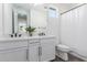 Bright bathroom with double sinks and white cabinets at 17329 W Gretna St, Surprise, AZ 85388