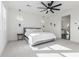 Spacious bedroom with gray platform bed and ensuite bathroom access at 17329 W Gretna St, Surprise, AZ 85388