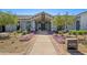 Inviting clubhouse entrance with landscaping at 17329 W Gretna St, Surprise, AZ 85388