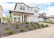 Two story home with front porch and landscaped yard at 17329 W Gretna St, Surprise, AZ 85388