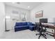 Home office with desk, chair, and comfortable sofa at 17329 W Gretna St, Surprise, AZ 85388