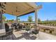 Covered patio with seating, offering views of the golf course at 17329 W Gretna St, Surprise, AZ 85388