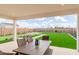 Patio with dining table and view of backyard at 17329 W Gretna St, Surprise, AZ 85388