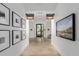 Spa hallway with artwork, leading to fitness studio and spa at 17329 W Gretna St, Surprise, AZ 85388