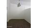 Dining area with dark hardwood floors and a chandelier at 17447 W Rock Wren Ct, Goodyear, AZ 85338