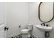 Modern bathroom with pedestal sink and patterned floor at 17662 W Whitefish Dr, Surprise, AZ 85388